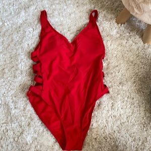 Gently worn Red Xhilaration One piece size M.